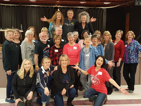 Active adults line dancing together at Myrtle Beach, 2018